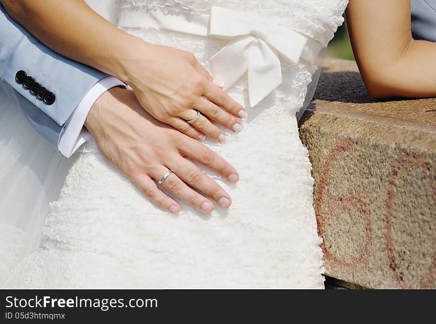 Wedding rings on bride and groom hands