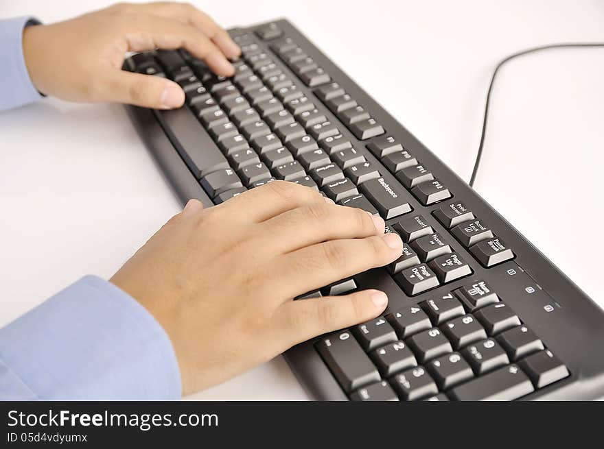 Hands typing on keyboard. This is office environment concept