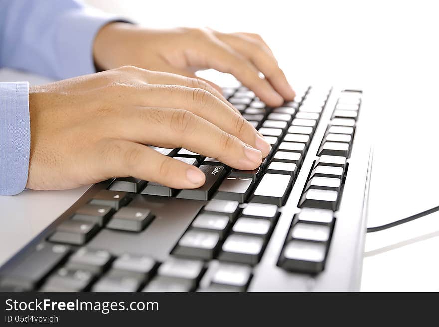 Hands typing on keyboard. This is office environment concept