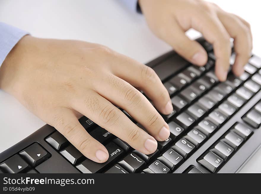 Hands typing on keyboard. This is office environment concept