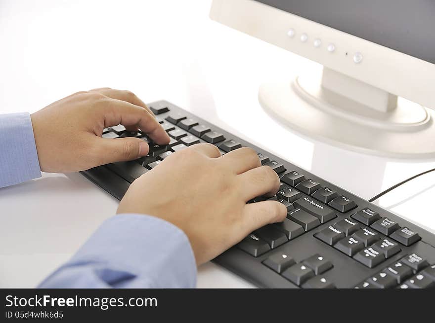 Hands typing on keyboard. This is office environment concept