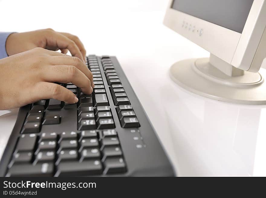 Hands typing on keyboard. This is office environment concept