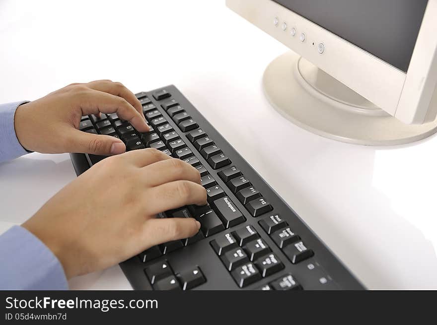 Hands typing on keyboard. This is office environment concept