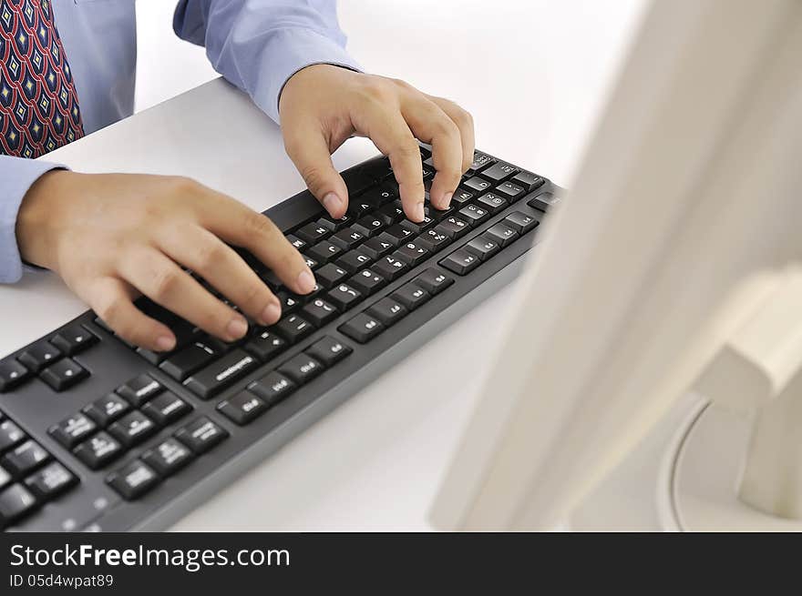 Hands typing on keyboard. This is office environment concept