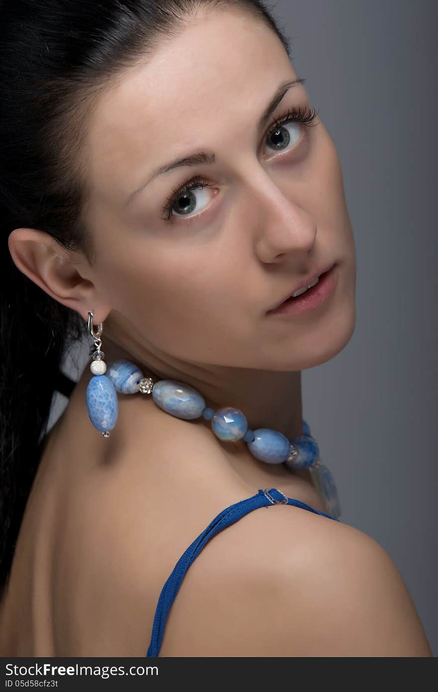 Close up portrait of gorgeous woman wearing jewelry