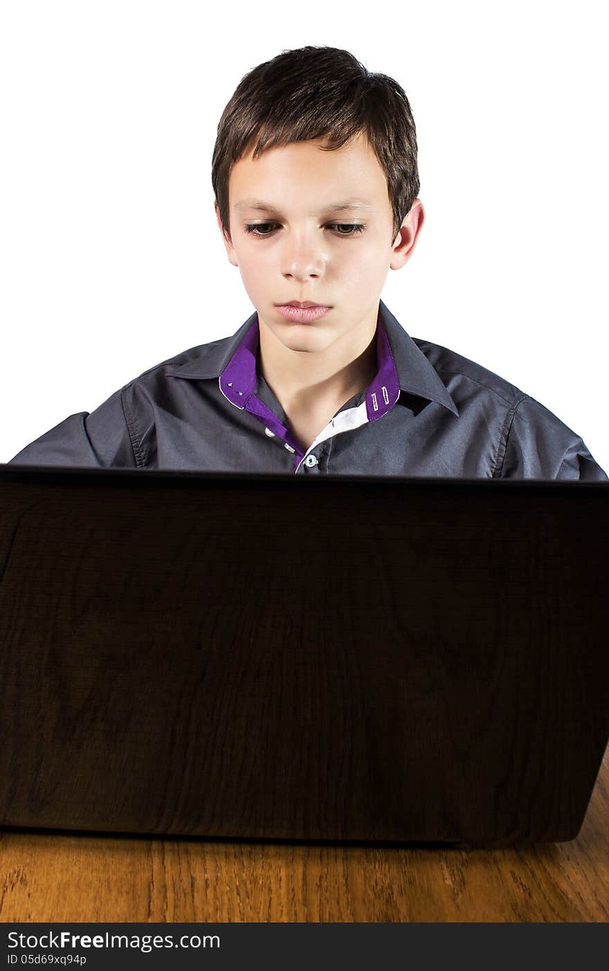 Teenager surfing the net ,over white background. It is not isolated