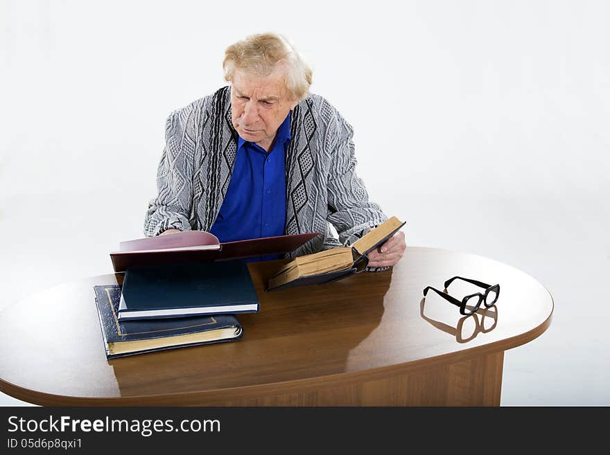 Face portrait of a smiling senior man sitting in an armchair. Face portrait of a smiling senior man sitting in an armchair