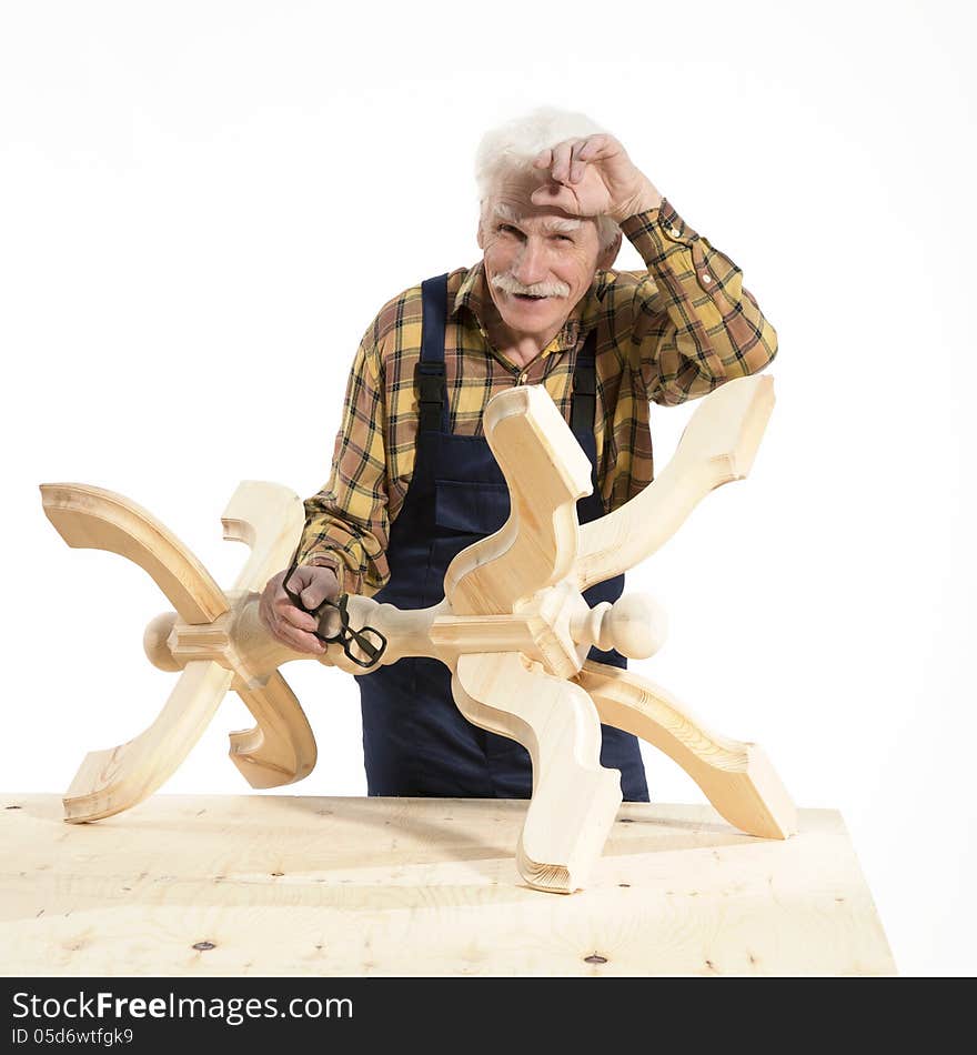 Old woodcarver work in the workshop. Old woodcarver work in the workshop