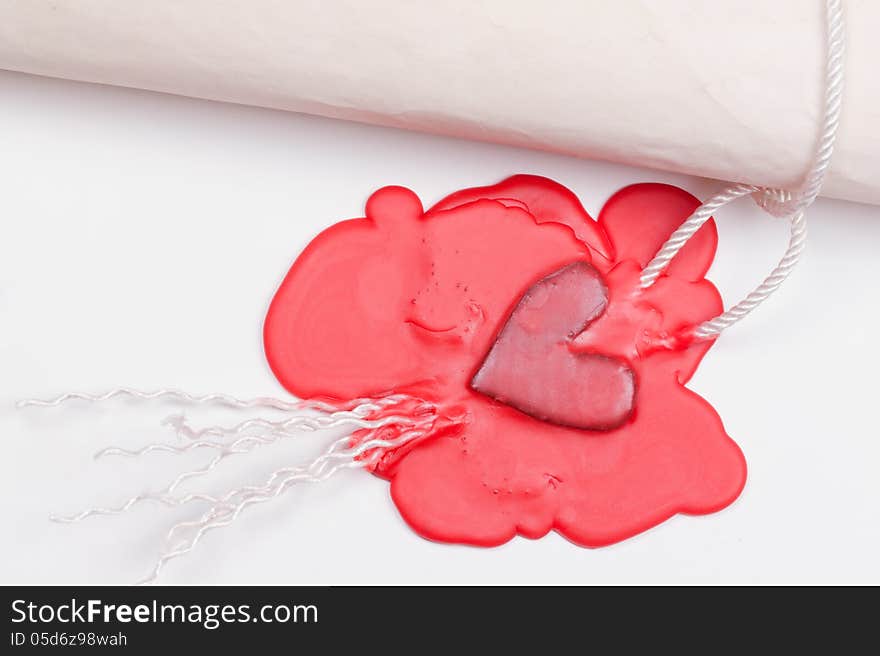 Love letter sealed the seal in the form of heart in red sealing wax