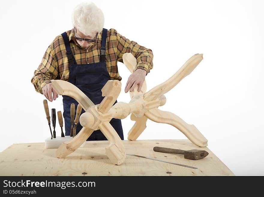 Old woodcarver work in the workshop. Old woodcarver work in the workshop