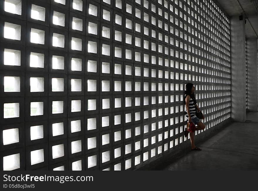 Beautiful woman with a very sad expression in dramatic space