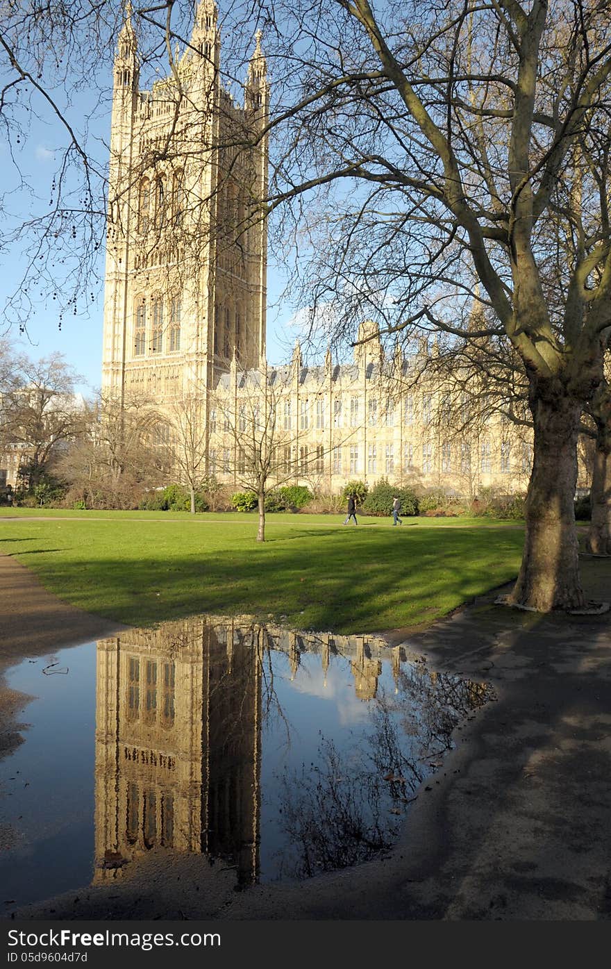 Victoria Tower reflected in puddle