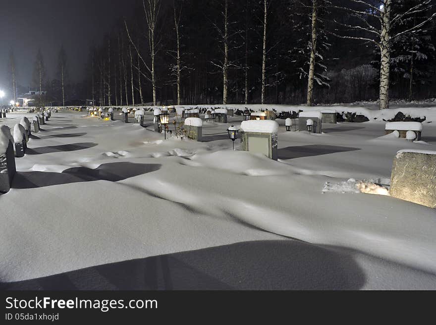 Cemetery in the evening light one winter evening