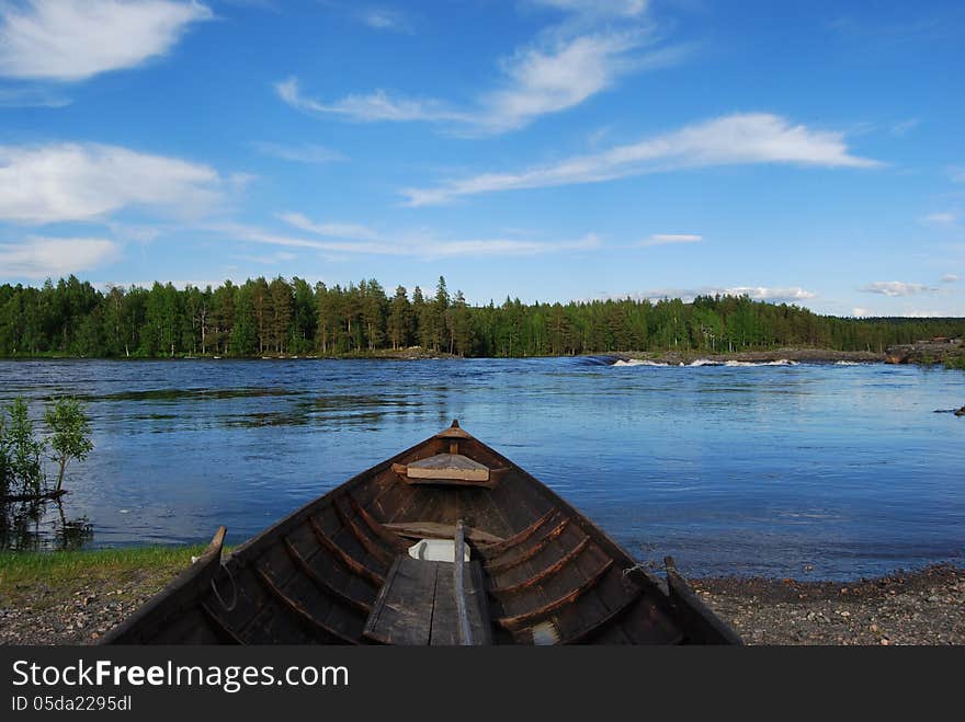 Rowing boat on the river one sommakväll waiting for a fishing trip. Rowing boat on the river one sommakväll waiting for a fishing trip