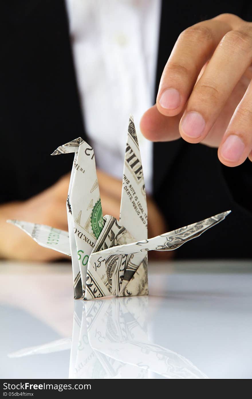 Origami paper cranes, money concept