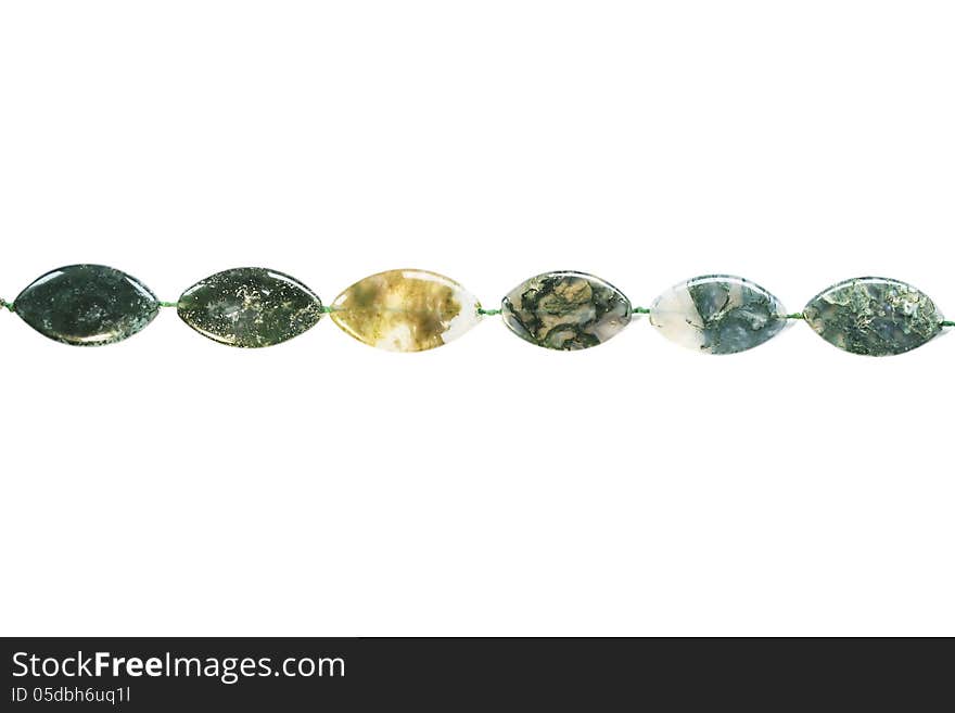 String of nephrite bead on white background