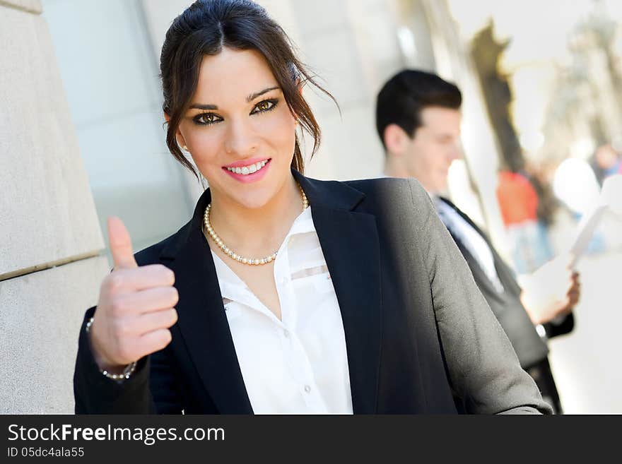 Attractive Businesswoman Showing Thumb Up Sign