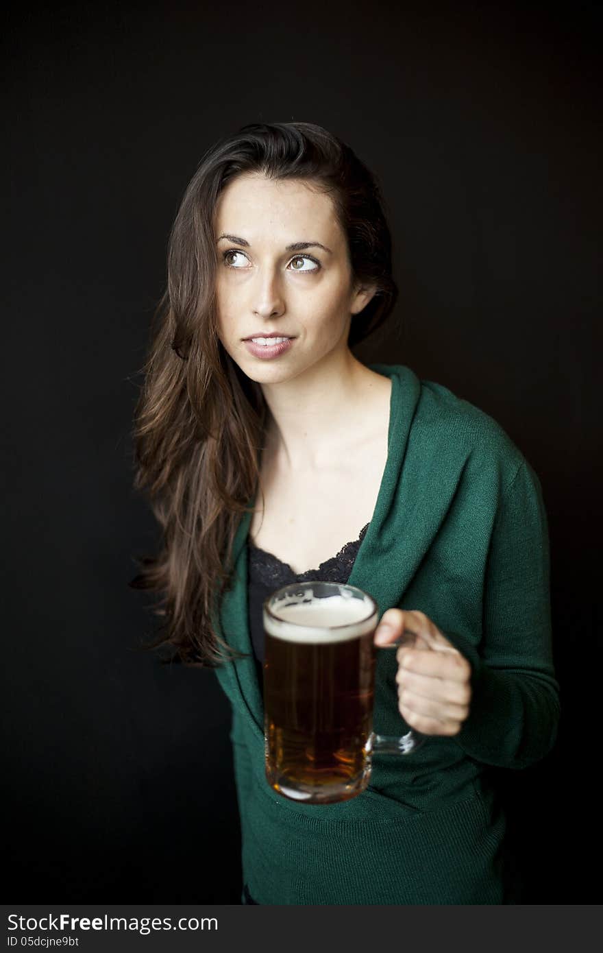 Beautiful Young Woman Holding Mug Of Beer