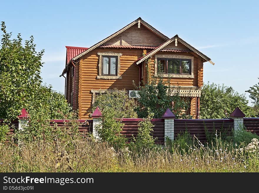 Beautiful new country wooden two-story house. Beautiful new country wooden two-story house