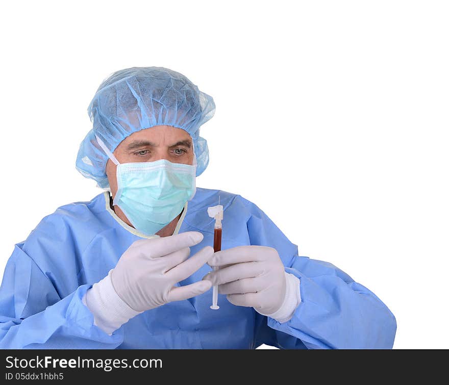 Healthcare worker holding a syringe of blood