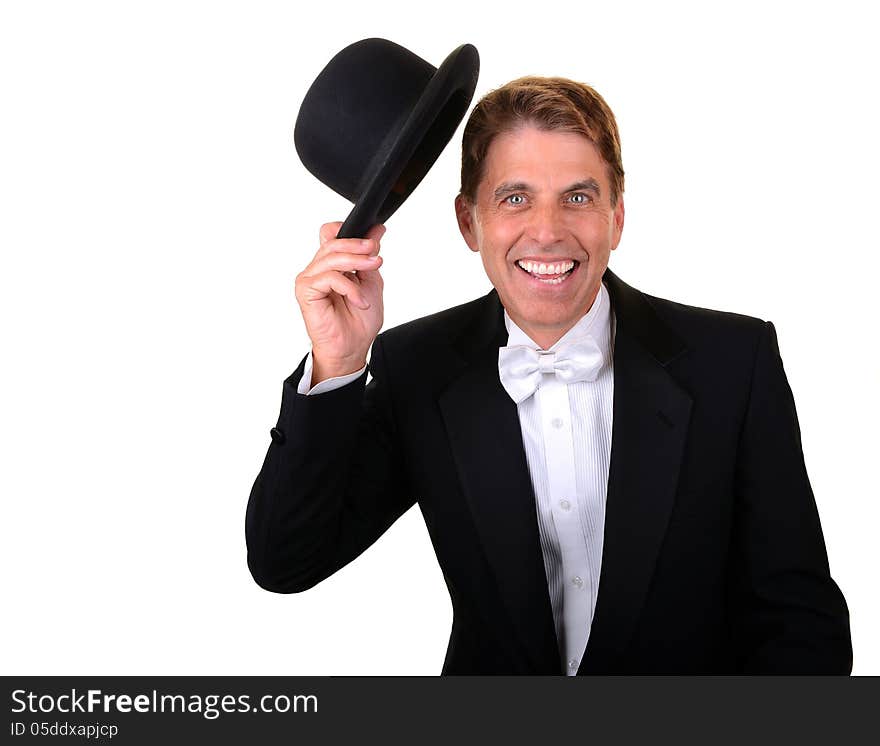 Happy man with green eyes wearing a tuxedo holding a hat isolated on white. Happy man with green eyes wearing a tuxedo holding a hat isolated on white.