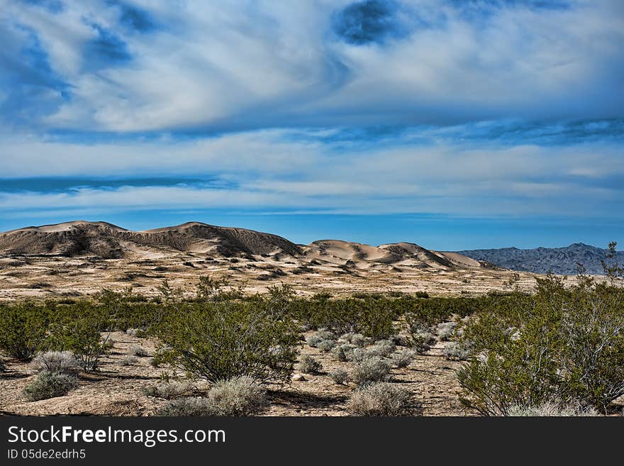 Kelso sand dunes in Mojave National monument with a beautiful dramatic sky in the back ground. Kelso sand dunes in Mojave National monument with a beautiful dramatic sky in the back ground