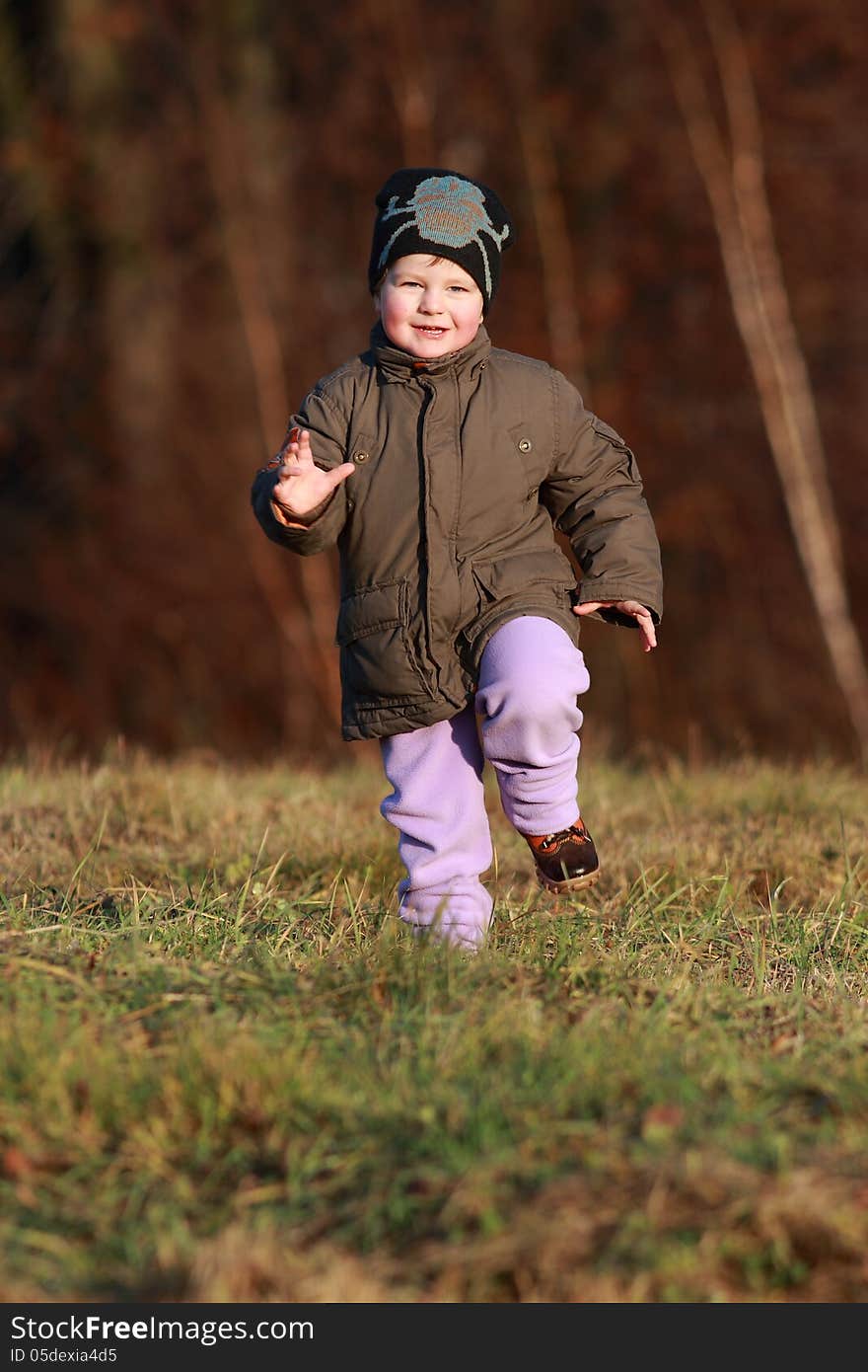 Little boy running with great joy