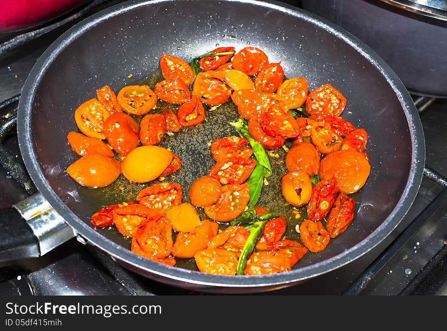 Some tomatoes cooked in a pot