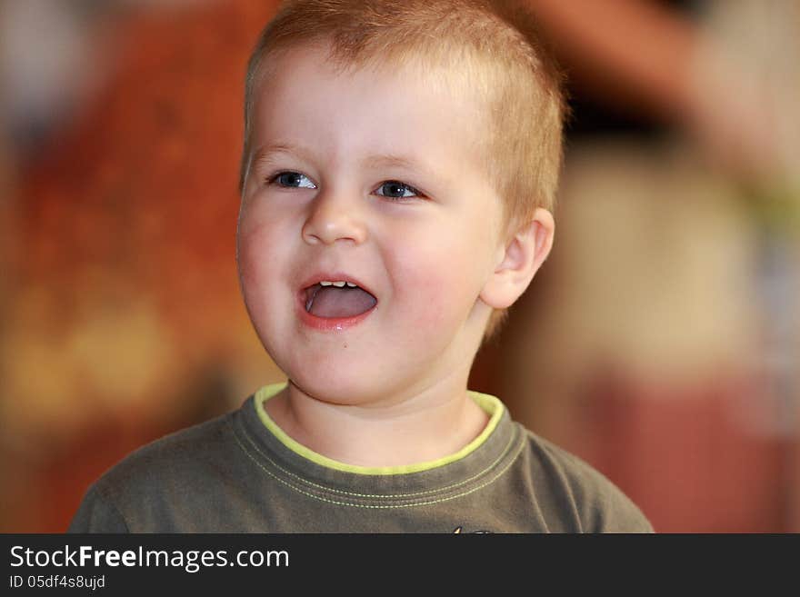 Little boy laughs heartily at zoo