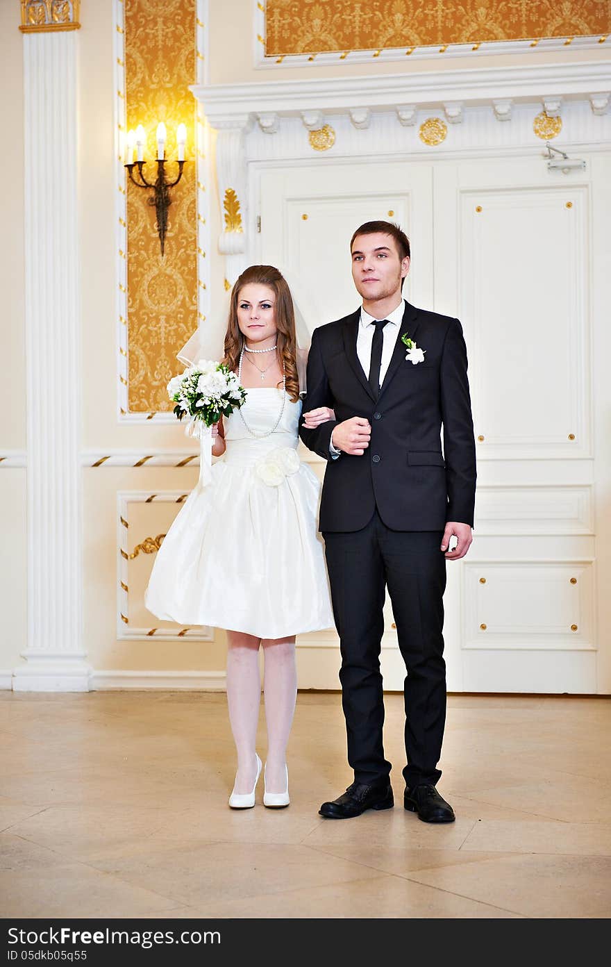 Bride and groom at wedding ceremony in registration hall