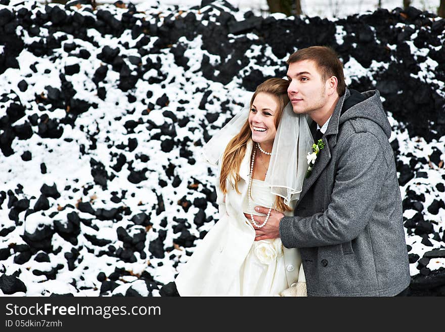 Happy bride and groom in winter day