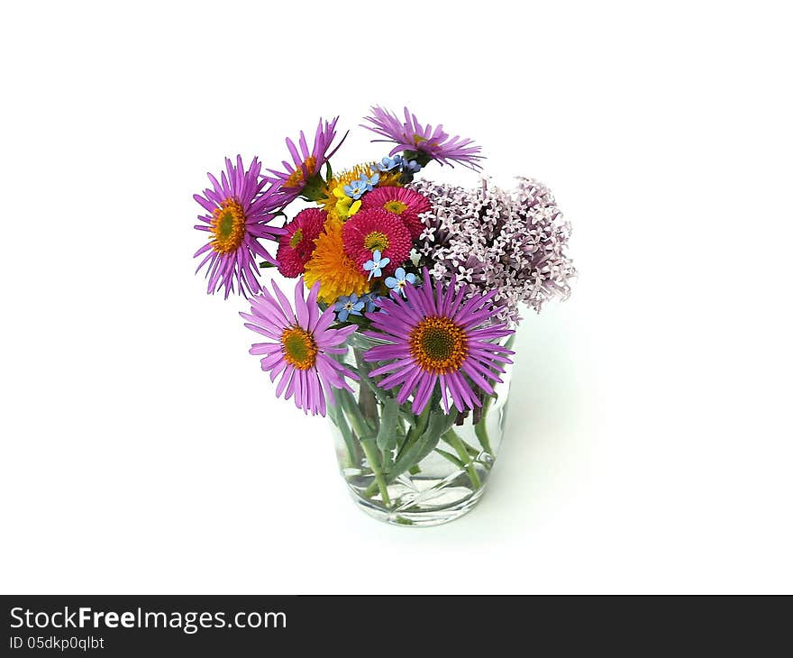 Flowers in a glass on white background