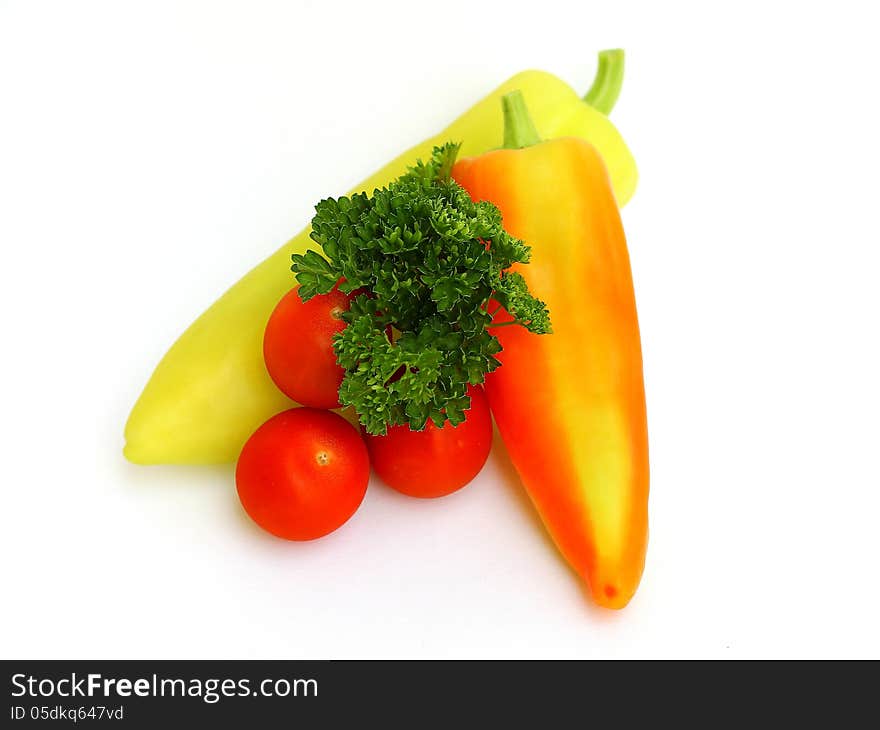 Peppers, tomatoes and parsley on white background