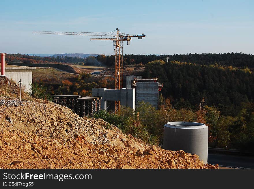 Building site - construction of new concrete pillars of highway bridge being built near Prague, Czech republic. Building site - construction of new concrete pillars of highway bridge being built near Prague, Czech republic.