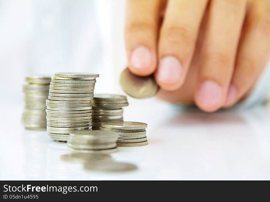 Hand holding coin stack