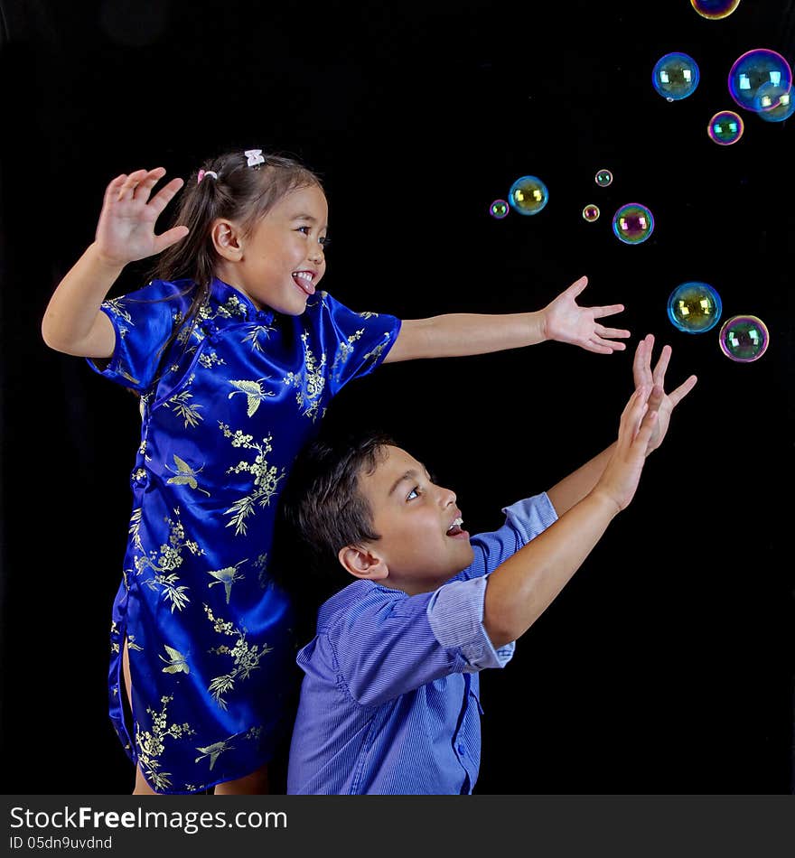 Children playing with bubbles