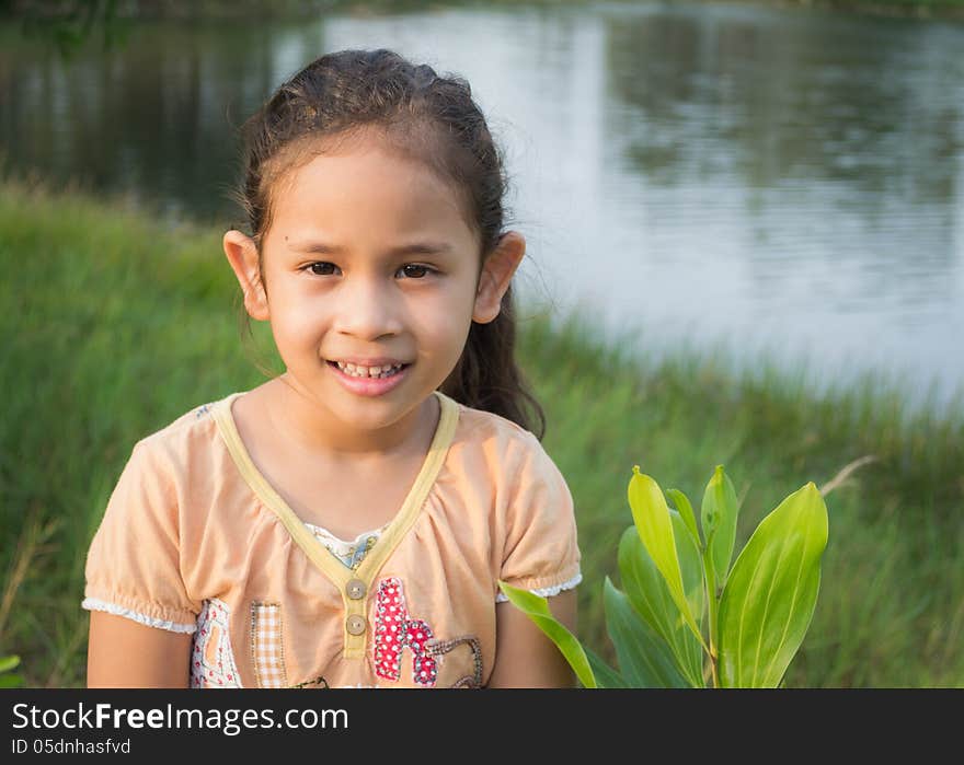 A cute girl in the park under sunlight