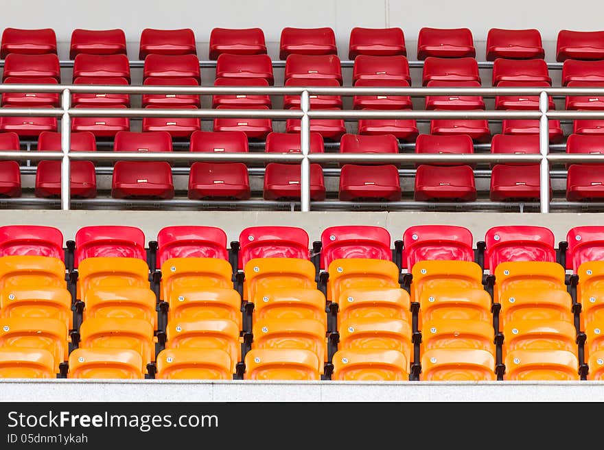 Rows of empty plastic stadium seats