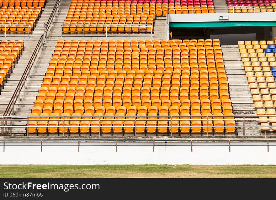 Rows of empty plastic stadium seats