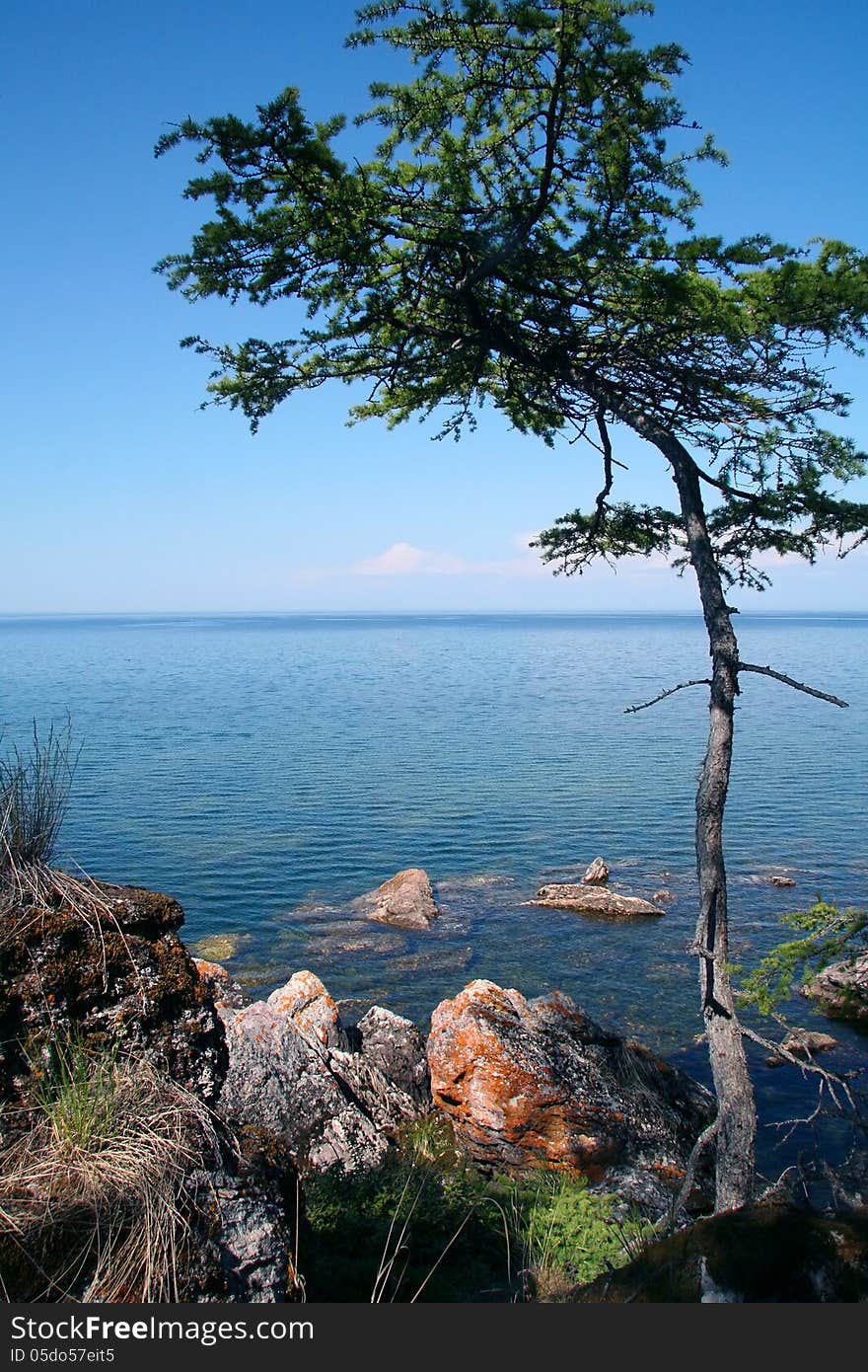 Rocky shore of the the Lake Baikal in the summer sun light