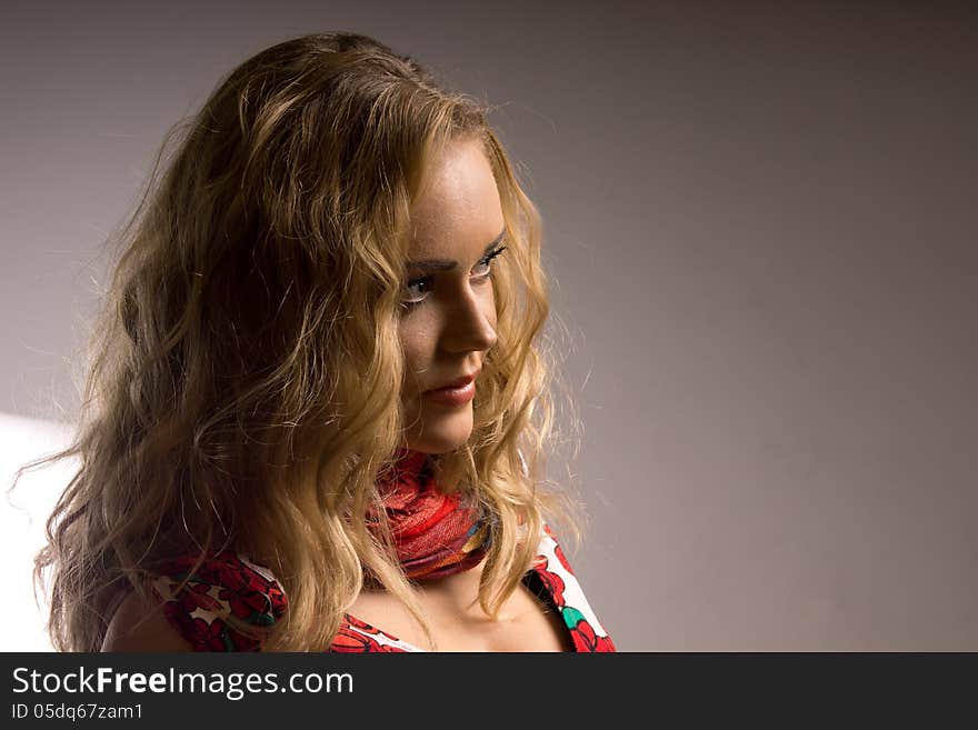 Portrait of a girl on a dark background. Blonde. Portrait of a girl on a dark background. Blonde.