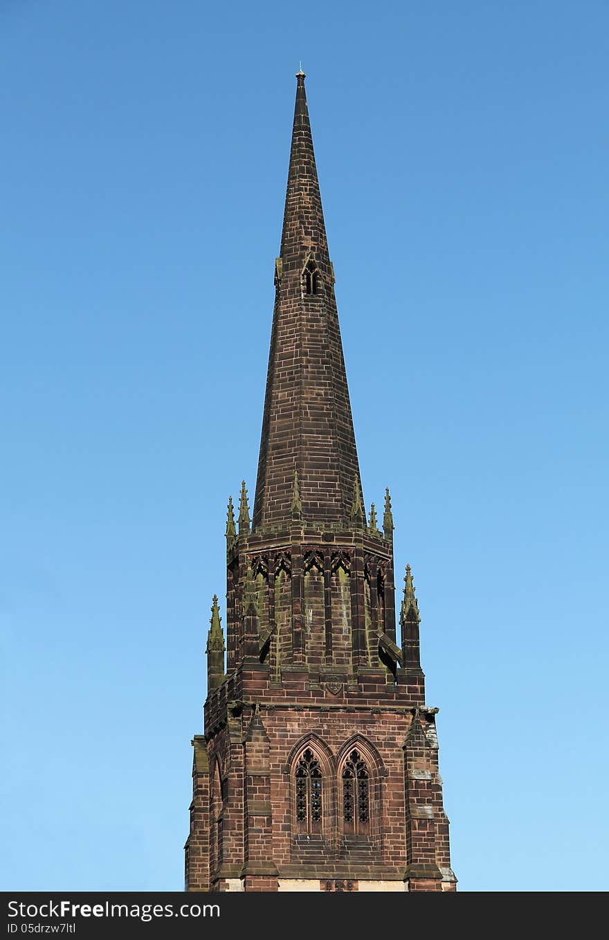 The Spire of a Country Church Against a Blue Sky. The Spire of a Country Church Against a Blue Sky.