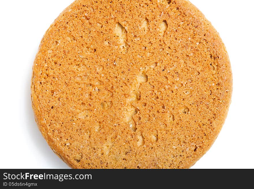 Round sweet oatmeal cookie. Macro backgrounds and texture