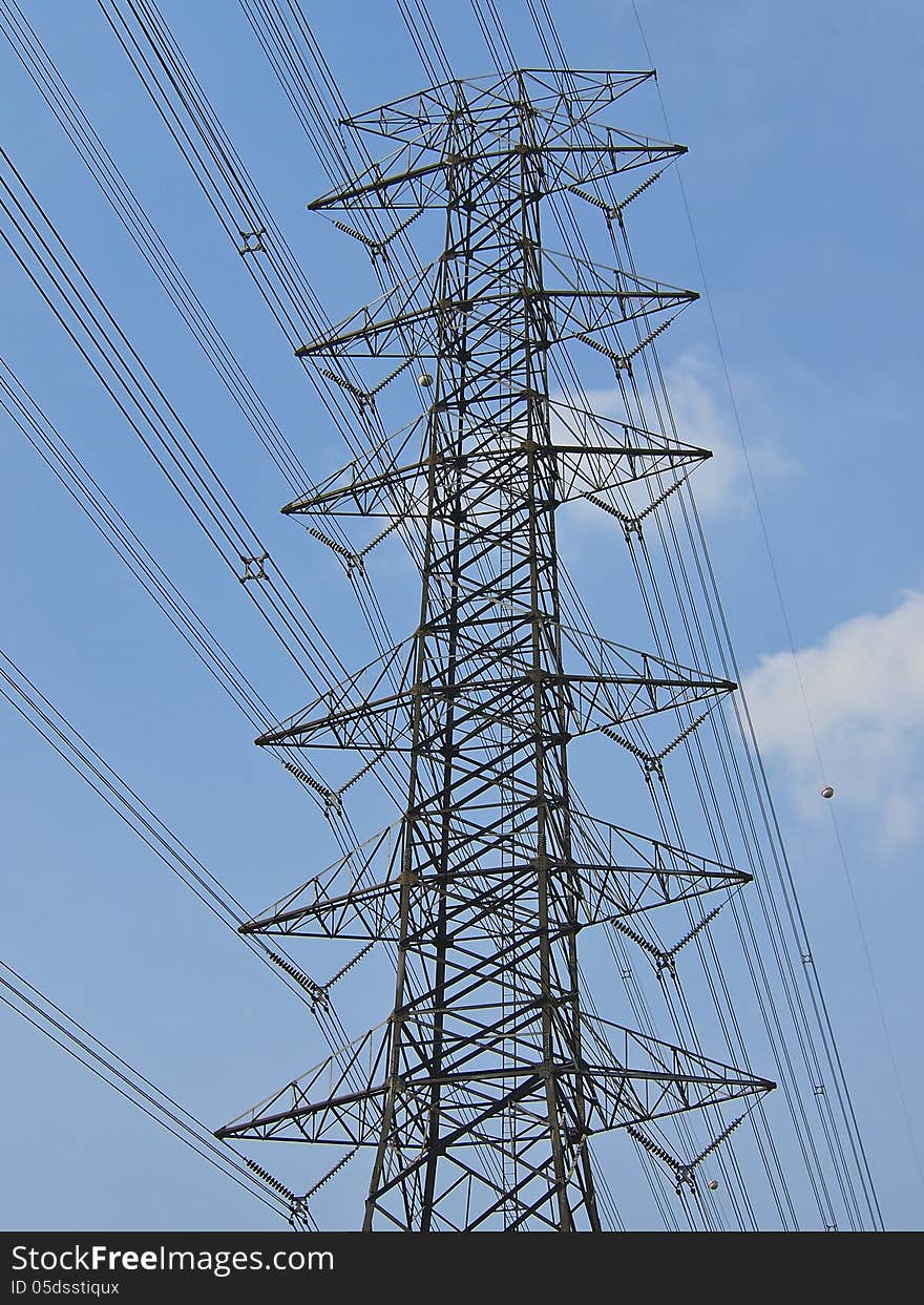 Perspective of high voltage tower in sunny day. Perspective of high voltage tower in sunny day