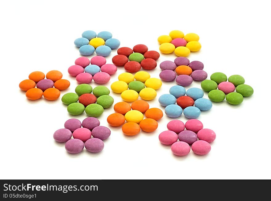 Colored chocolate candy on a white background. Colored chocolate candy on a white background