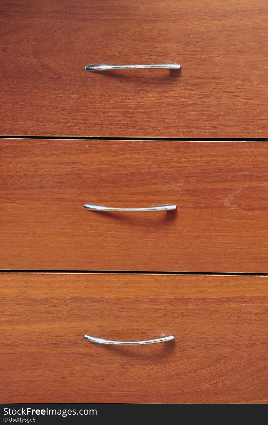 Background of brown wooden chest of drawers. Background of brown wooden chest of drawers.