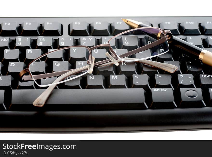 Pen With A Golden Feather And Glasses