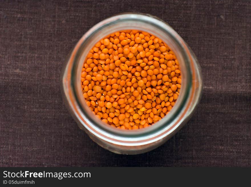 Red lentils in a jar from upper view