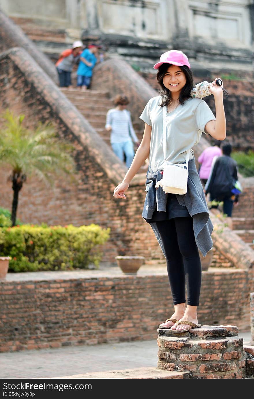 Asian woman enjoying at Buddhist temple