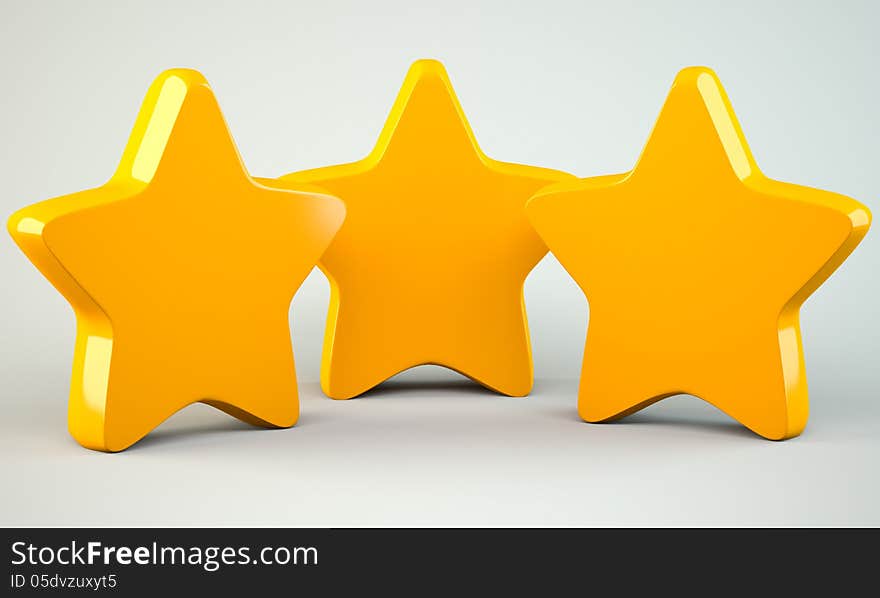 Three golden stars on grey background